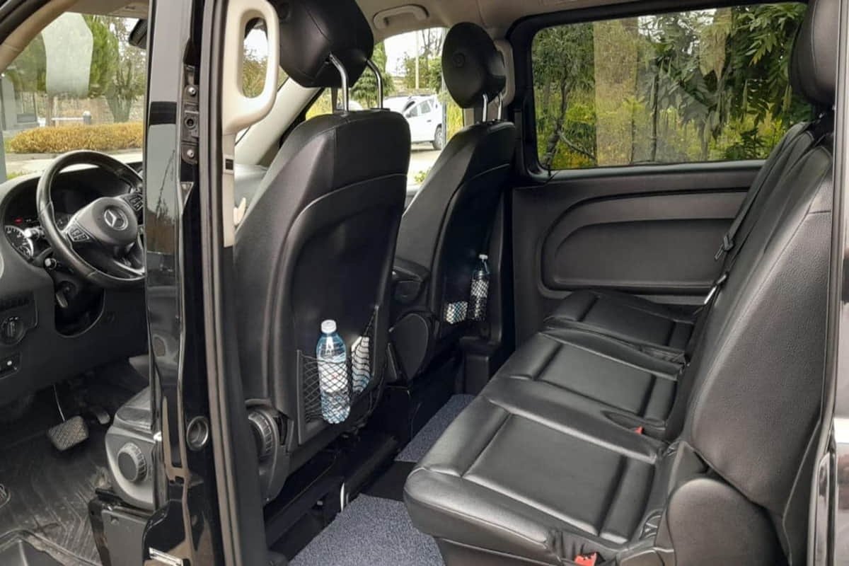 Front interior of 7-seater minivan with driver area and passenger seats